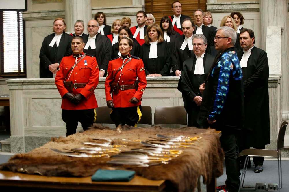 John Woods / The Canadian Press
Supreme Court Chief Justice Richard Wagner, right, and the other Supreme Court judges and Manitoba court officials at the Manitoba Law Courts during the presentation ceremony Thursday.