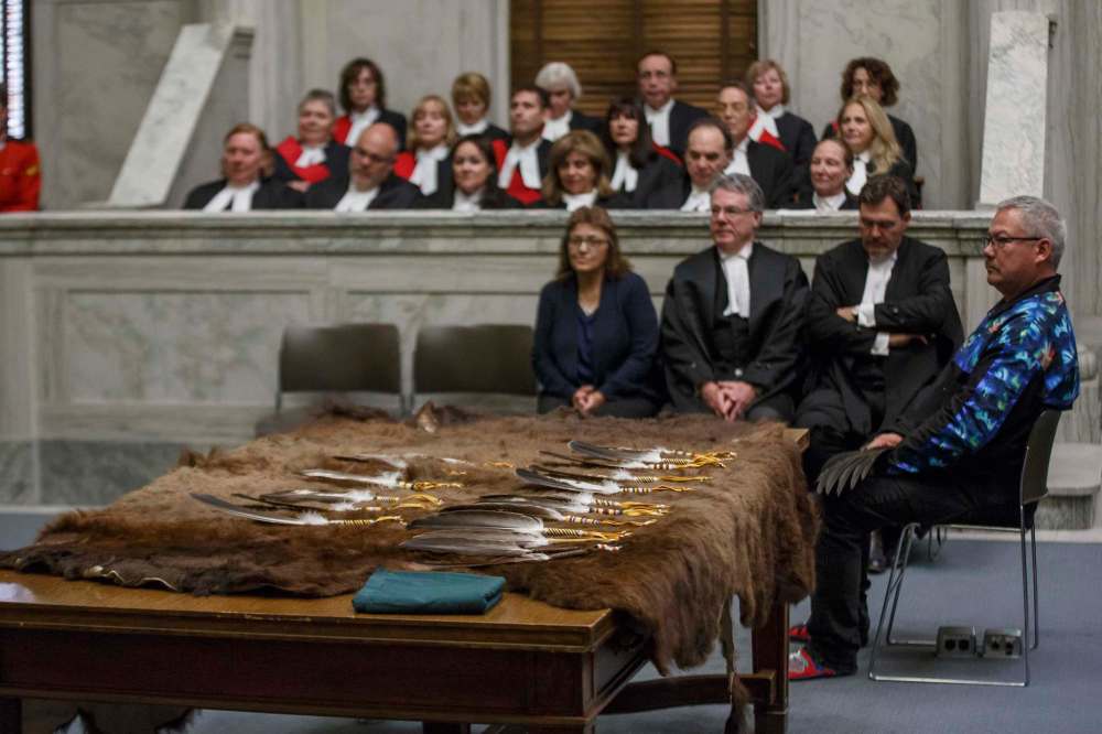 The blessed eagle feathers were presented to the courts during a special joint sitting of the Court of Queen’s Bench and the Provincial Court of Manitoba on Thursday. (Mike Deal / Winnipeg Free Press)