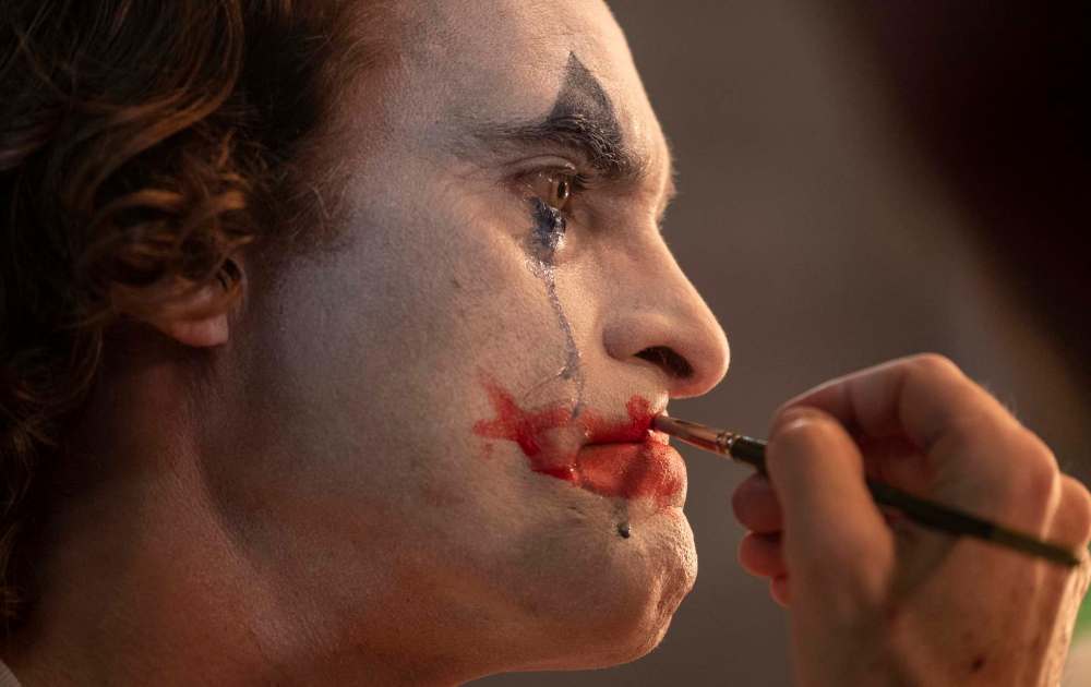 Arthur Fleck (Joaquin Phoenix) is a guy who lives on the edge of destitution, both spiritual and economic. (Warner Bros.)