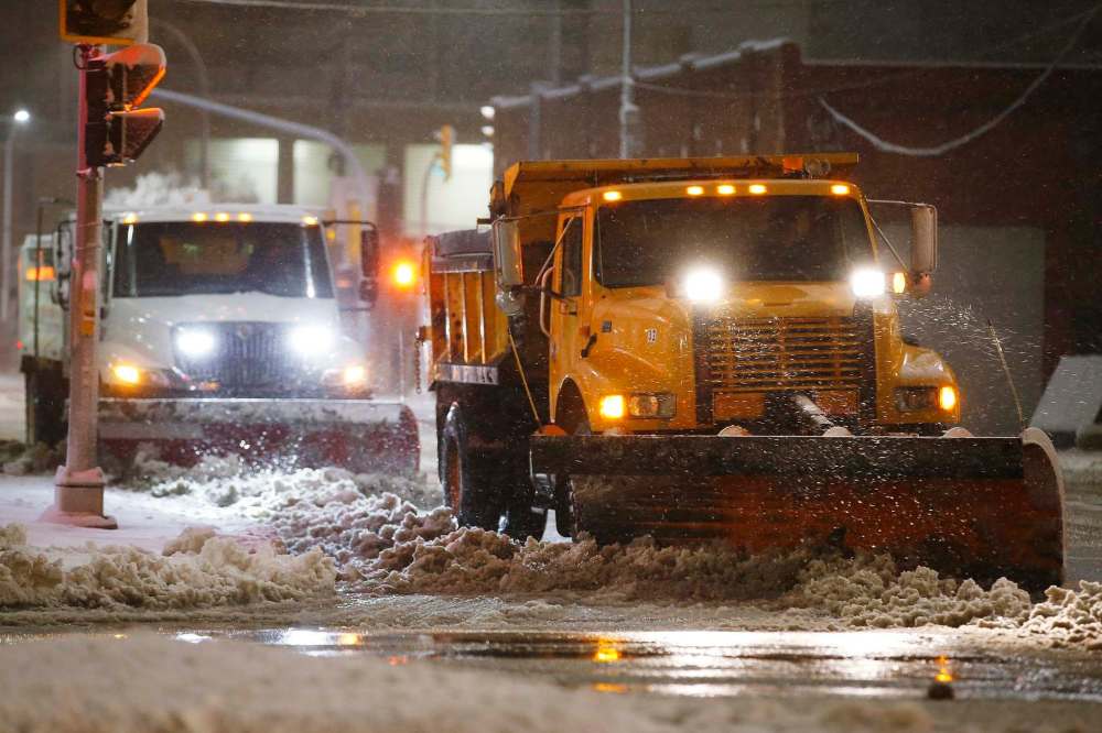 Initially, the city had pencilled in about $11.86 million for snowclearing from September to the end of the year — enough to cover two storms — but the cost will likely be higher to dig out from the heavy, wet snow blanketing the city this week. (John Woods / The Canadian Press)