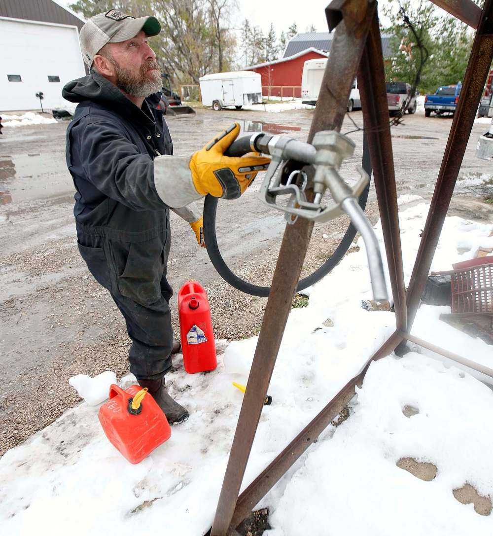 The MacDonalds have been helping neighbours fill jerry cans of gasoline at their farm to pour into generators.