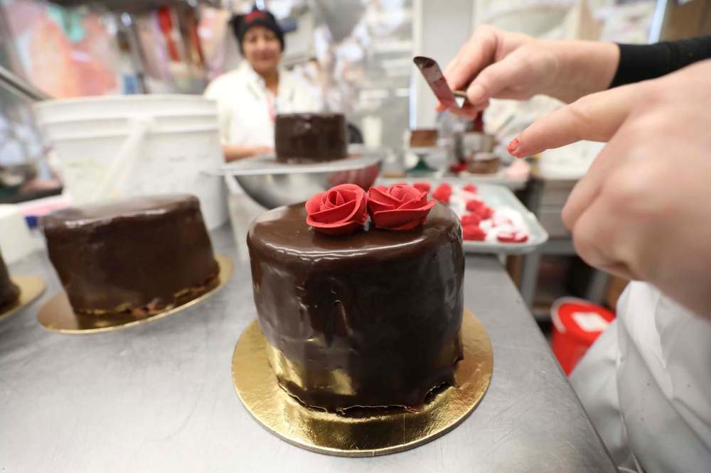 Decorating cakes, such as with these rose petals made from icing, is a large part of Goodies' business. (Ruth Bonneville / Winnipeg Free Press)