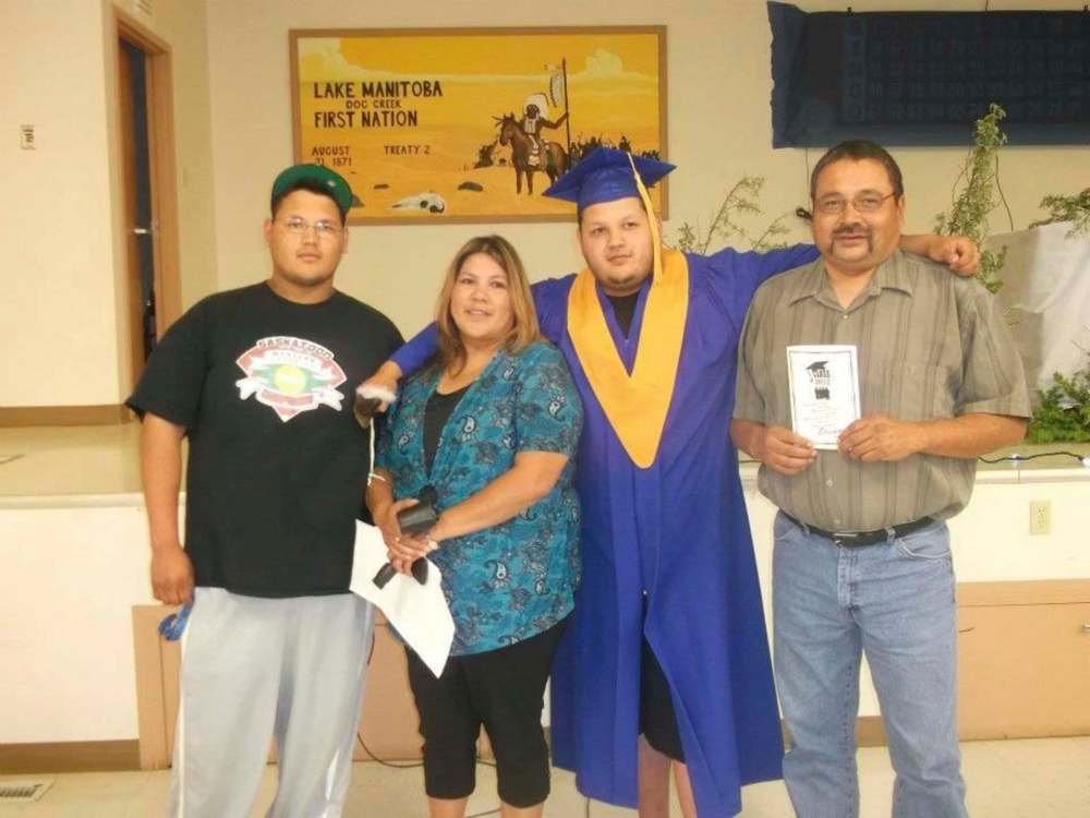 SUPPLIED
Todd (left) with his parents and brother at Avery's high school graduation. Todd Maytwayashing was working for Forbes Brothers Ltd., a sub-contractor of Manitoba Hydro, helping build the Keeyask transmission line near Gillam when he was killed while helping secure a load of steel off a truck in 2018.