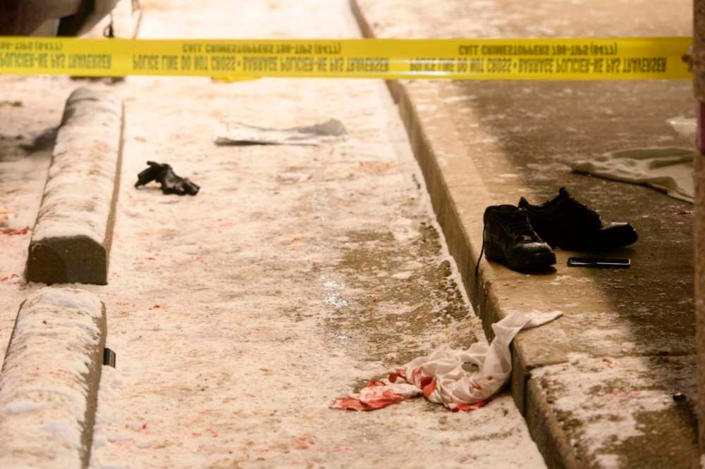 Mike Sudoma / Winnipeg Free Press
A bloody shirt on the ground in front of the 7-Eleven at the corner of Alrington St. and Ellice Ave. Thursday night.