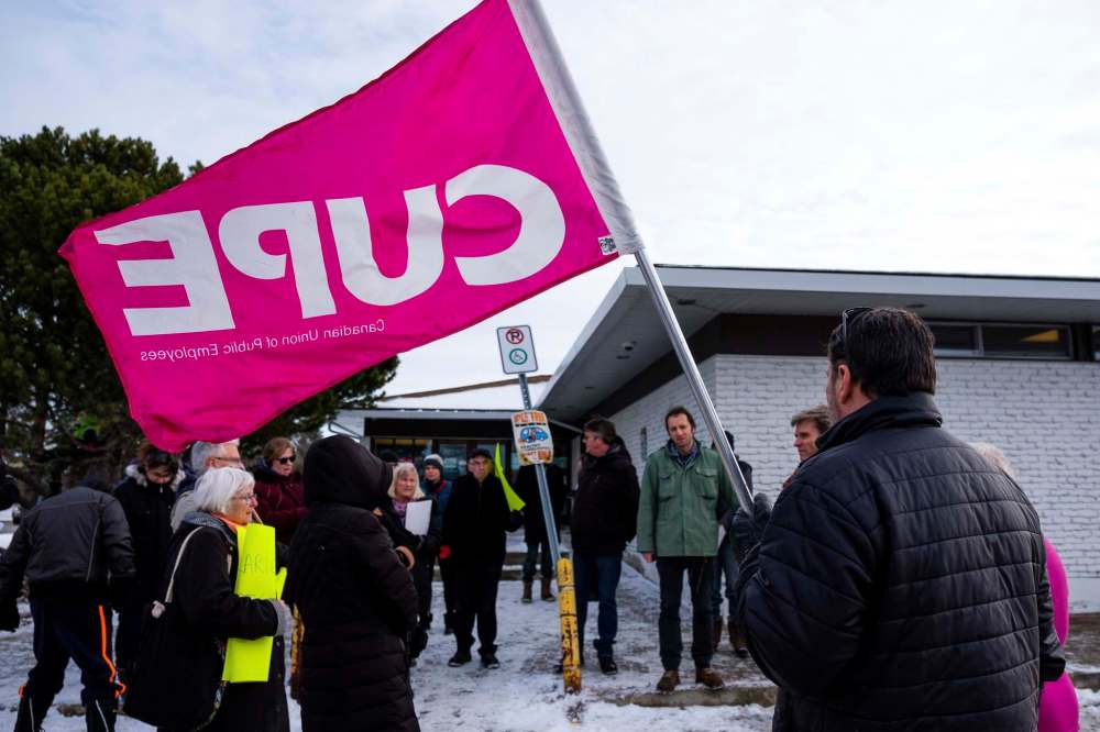 About 40 community members attended a rally on Saturday to keep the Westwood Library open. (Daniel Crump / Winnipeg Free Press)