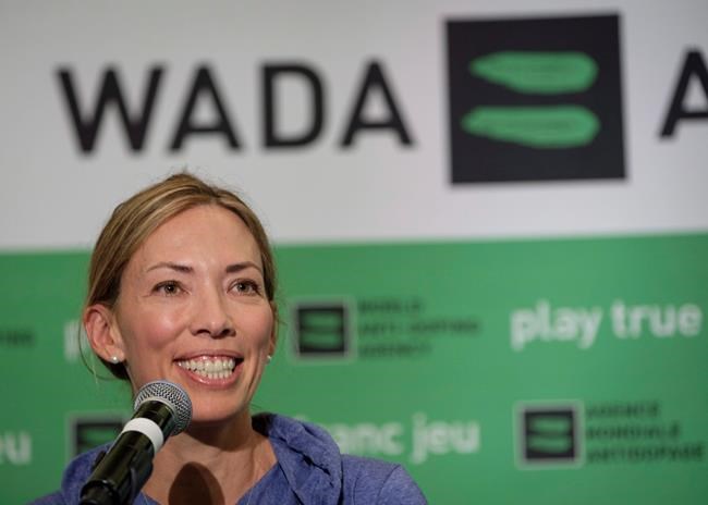 FILE - In this June 5, 2018, file photo, Beckie Scott, World Anti-Doping Agency athlete committee chairperson, speaks at a news conference following the agency's first Global Athlete Forum in Calgary, Alberta One of her proudest accomplishments was getting an athlete charter of rights approved and into the WADA code book. That happened Thursday, Nov. 7, 2019, the last day of her term as chair. “My hope is that going forward, voices that challenge or dissent will be heard and taken into consideration rather than undermined or dismissed,” Scott said in her speech. “And my hope is that going forward, balance and independence will be restored to these tables, so that all interests and priorities here are aligned with equality of opportunity and fairness, rather than the business of sport.”. (Jeff McIntosh/The Canadian Press via AP, File)