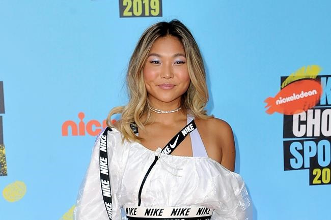 FILE - In this July 11, 2019, file photo, Olympic champion snowboarder Chloe Kim arrives at the Kids' Choice Sports Awards in Santa Monica, Calif. Chloe Kim is taking a year off from competitions to focus on her class schedule at Princeton. She's putting out a video to explain the move to her fans. (Photo by Richard Shotwell/Invision/AP, File)
