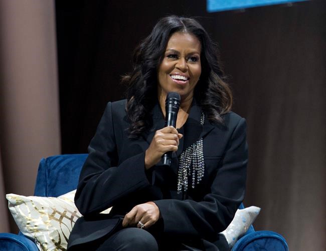 FILE - In this Nov. 17, 2018 file photo, former first lady Michelle Obama speaks to the crowd as she presents her anticipated memoir