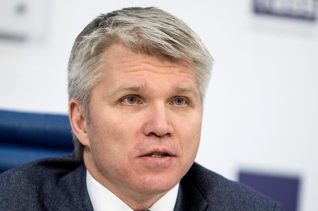 FILE - In this Feb. 5, 2018 file photo, Russia's sports minister Pavel Kolobkov attends a press conference in Moscow, Russia. Speeches by representatives from the U.S. and Russia delivered Wednesday, Nov. 6, 2019, in Poland, illustrated the wide gap in perceptions about the Russian doping scandal that has upended Olympic sports. U.S. Anti-Doping Agency head Travis Tygart said Russia can no longer be allowed to steal medals from clean athletes. A few minutes later, Kolobkov said Russia has paid the price for its misdeeds and should be welcomed back into the fold. Russia is under threat of missing the Tokyo Olympics. (AP Photo/Pavel Golovkin, File)