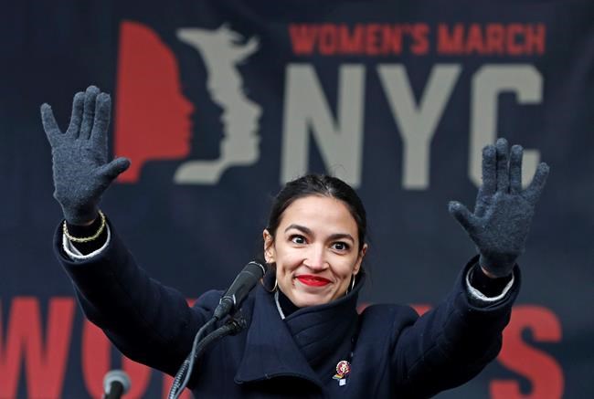 FILE - In this Jan. 19, 2019, file photo, U.S. Rep. Alexandria Ocasio-Cortez, D-New York, waves to the crowd after speaking at Women's Unity Rally organized by Women's March NYC at Foley Square in Lower Manhattan in New York. On Thursday, Feb. 14, newly-elected Rep. Alexandria Ocasio-Cortez led a chorus of cheers as Amazon announced it was abandoning plans to build a sought-after headquarters in New York City. Activists berated the online giant for a $3 billion package of tax breaks she said the city could better invest in hiring teachers or fixing the subway. (AP Photo/Kathy Willens, File)