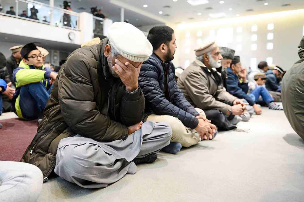 CP
Members of Ahmadiyya Muslim Jama`at Canada gather at the Baitul Islam Mosque during a special prayer for the victims of an attack on Muslims at the Al Noor and Linwood Mosques in Christchurch, New Zealand, in Vaughan, Ont., on Friday, March 15, 2019. THE CANADIAN PRESS/Christopher Katsarov