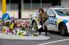 CP
A woman places flowers at a make-shift memorial near the mosque in Christchurch, New Zealand, Saturday, March 16, 2019, where one of the mass shootings occurred yesterday. (AP Photo/Mark Baker)