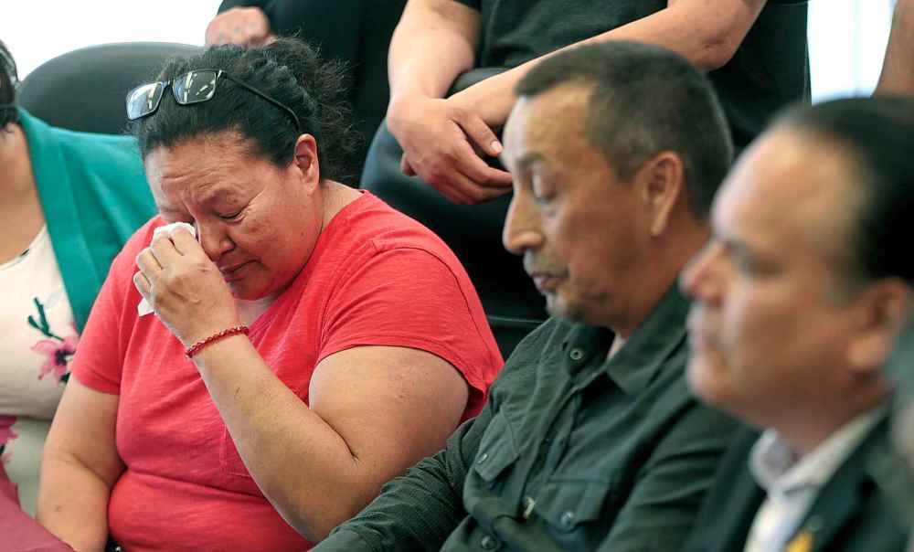 PHIL HOSSACK / WINNIPEG FREE PRESS
Christine Wood's mother Melinda fights back tears as her husband George reads a statement at a press conference after Christine's killer was sentenced Tuesday.