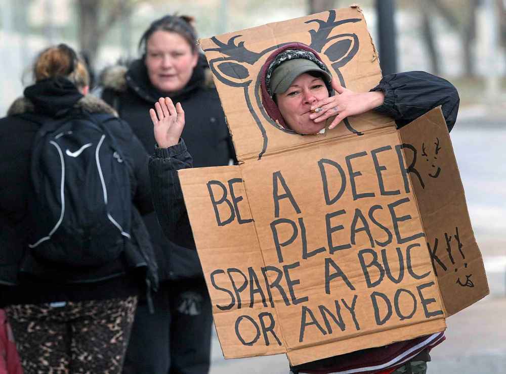 JOE BRYKSA / WINNIPEG FREE PRESS FILES
Panhandlers wearing creative signs in downtown Winnipeg.