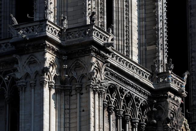 Gargoyles of Notre Dame cathedral are pictured Friday, April 19, 2019 in Paris. Rebuilding Notre Dame, the 800-year-old Paris cathedral devastated by fire this week, will cost billions of dollars as architects, historians and artisans work to preserve the medieval landmark. (AP Photo/Thibault Camus)