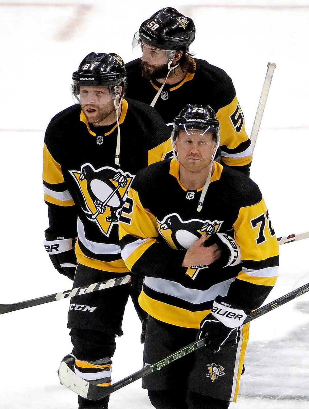 AP Photo/Gene J. Puskar
Pittsburgh Penguins' Patric Hornqvist, Phil Kesse and Kris Letang skate off the ice at the end of Game 4 of an NHL hockey first-round playoff series against the New York Islanders in Pittsburgh, Tuesday. The Islanders won 3-1, sweeping the series.