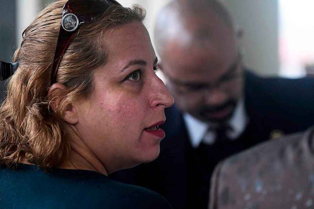 Carlos Giusti / AP
Marcia Vazquez Rijos arrives at the federal court of Old San Juan to face trial for allegedly conspiring with her boyfriend Jose Ferrer Sosa and her sister Aurea Vazquez Rijos, in the 2005 murder of former Winnipegger Adam Anhang.