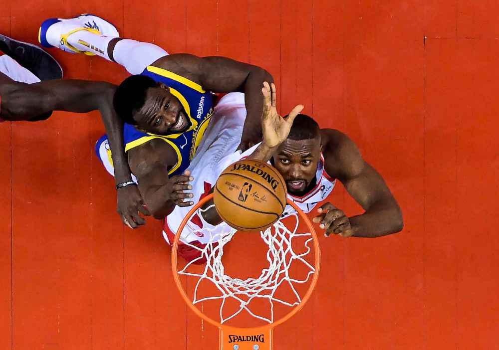 THE CANADIAN PRESS/Nathan Denette
Golden State Warriors forward Draymond Green battles Toronto Raptors centre Serge Ibaka during first half Game 5 NBA Finals basketball action in Toronto on Monday.
