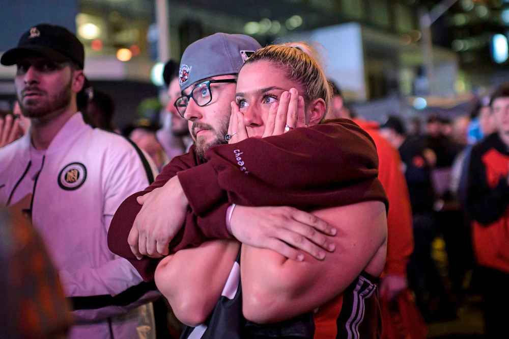 THE CANADIAN PRESS/Christopher Katsarov
Raptors fans react outside of Scotiabank Arena after the Toronto Raptors lost Game 5 of the NBA Final to the Golden State Warriors in Toronto, on Monday.