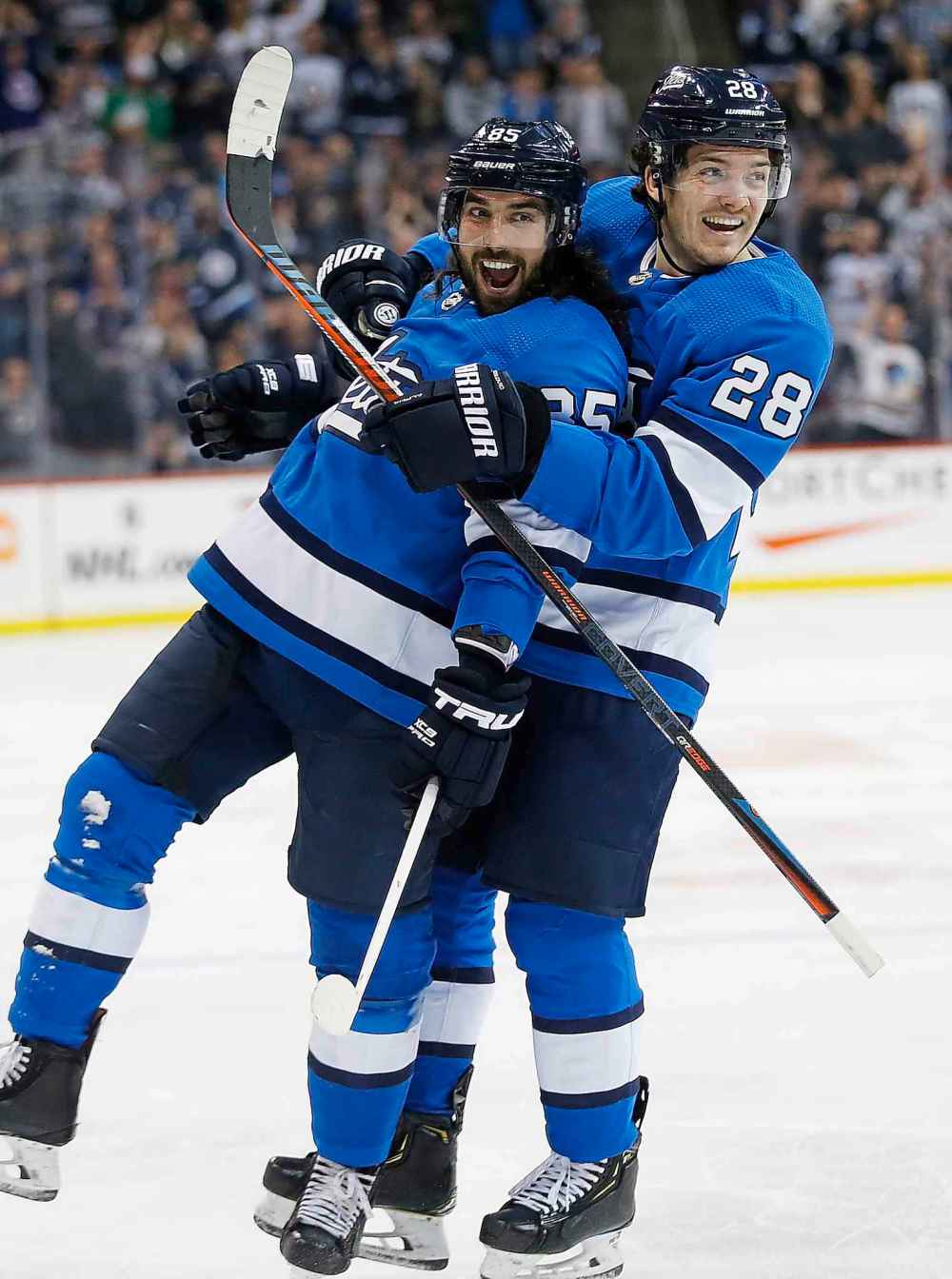 THE CANADIAN PRESS/John Woods
Winnipeg Jets' Mathieu Perreault and Jack Roslovic celebrate Perreault's goal on the Calgary Flames in March. The pair makeup two-thirds of the Jets' fourth line and, along with centre Andrew Copp, have been one of the team's most dangerous.
