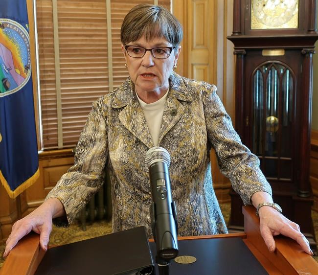Kansas Gov. Laura Kelly speaks to reporters, Monday, April 22, 2019, at the Statehouse in Topeka, Kansas. Kelly has vetoed a bill that would require clinics to tell patients that a medication abortion can be stopped after they take the first of two pills. (AP Photo/John Hanna)
