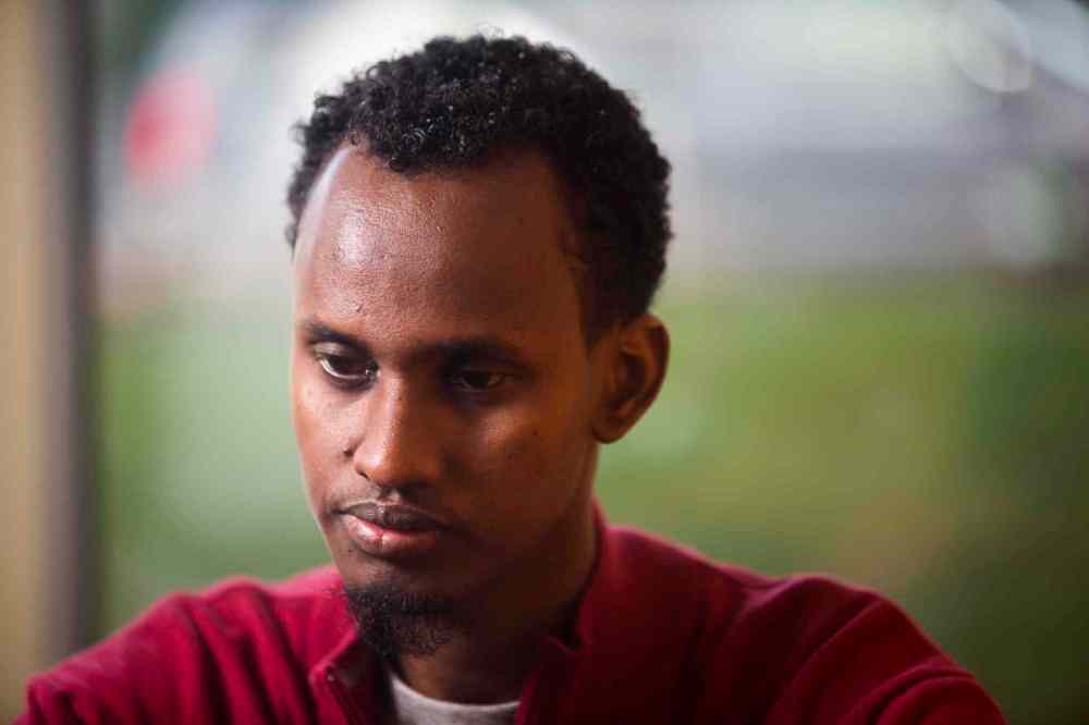 Yahya Samatar at the Welcome Place in Winnipeg on Wednesday, Aug. 12, 2015. Samatar has spent much of the last few days filling out many complex documents with help from staff. (Mikaela MacKenzie / Winnipeg Free Press)