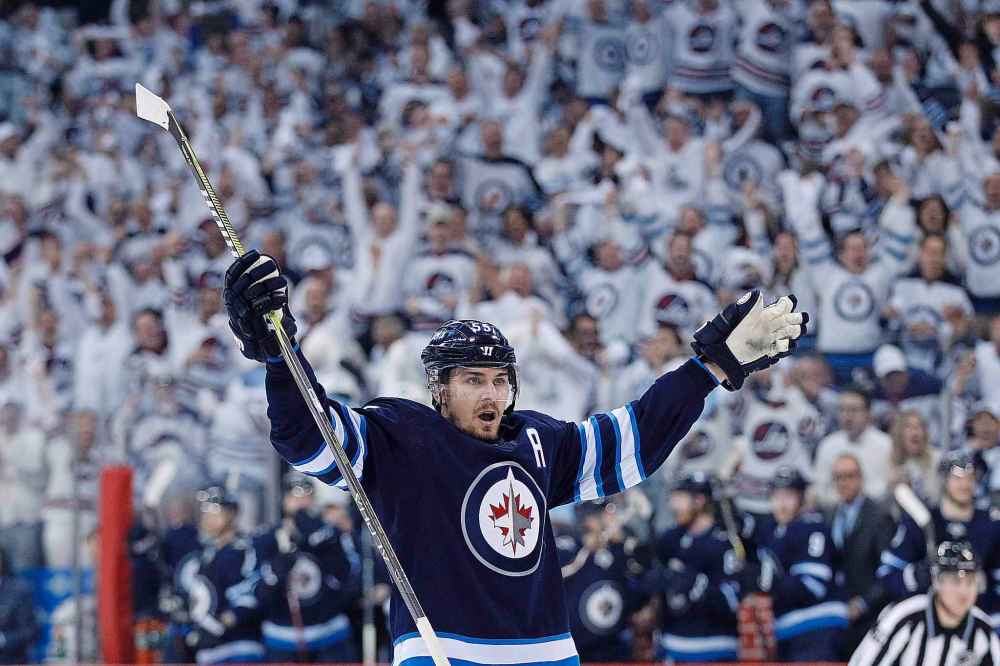 CP
Winnipeg Jets' Mark Scheifele (55) celebrates his goal against the Minnesota Wild during second period NHL game one playoff action in Winnipeg on Wednesday, April 11, 2018. THE CANADIAN PRESS/John Woods