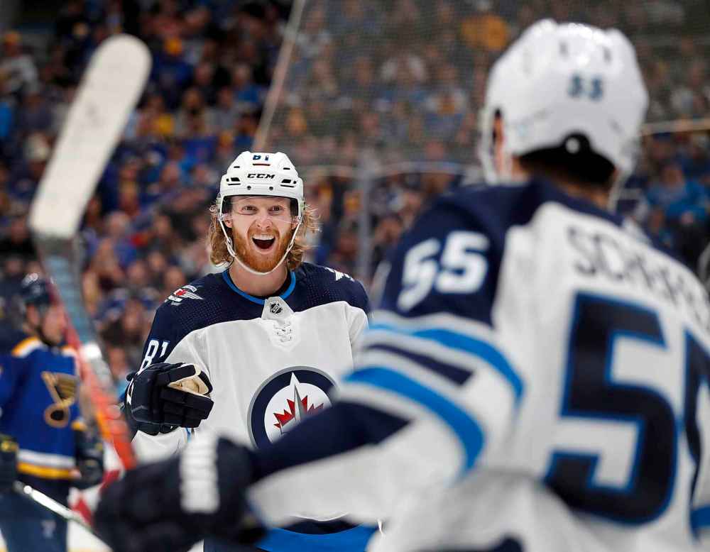 Jeff Roberson / The Associated Press files
Winnipeg Jets' Kyle Connor, left, is congratulated by Mark Scheifele after scoring during Game 3 against the St. Louis Blues in the Jets 6-3 win. Scheifele is currently the third-highest paid Jet behind Dustin Byfuglien and Connor Hellebuyck but that's about to change with Connor and Patrik Laine both due big pay raises this summer.