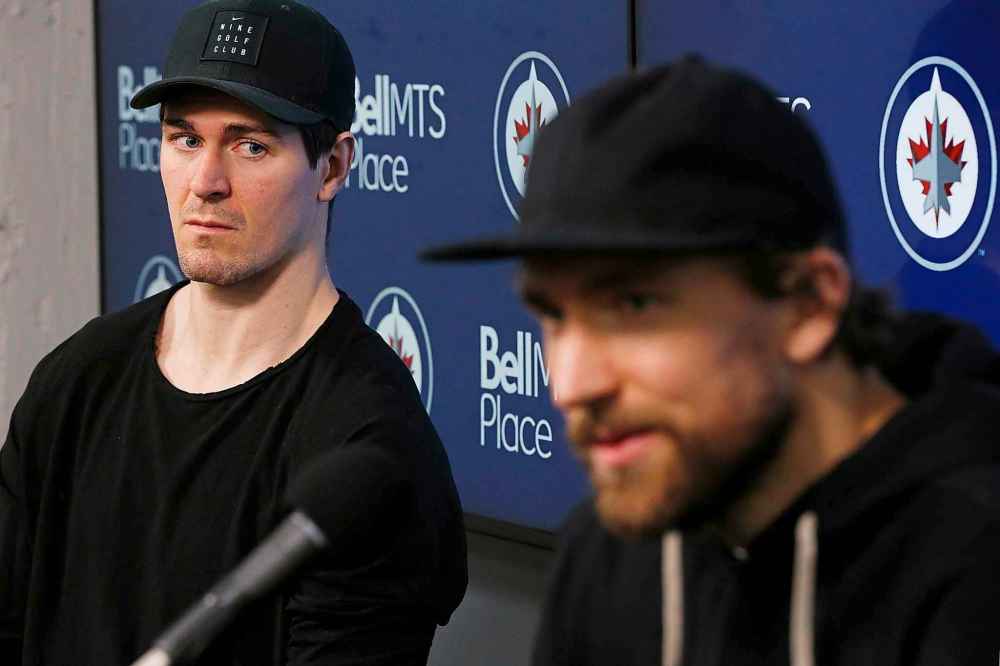 John Woods / THE CANADIAN PRESS
Winnipeg Jets' Mark Scheifele, left, sat silently as Blake Wheeler spoke to the media at the team's season-closing press conference after losing in the first round of the NHL playoffs to the St. Louis Blues.