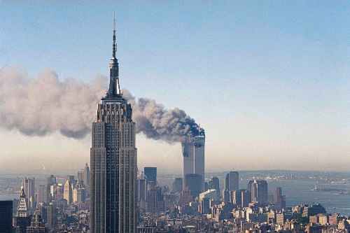 In this Sept. 11, 2001 file photo the twin towers of the World Trade Center burn behind the Empire State Building in New York after terrorists crashed two planes into the towers causing both to collapse.(AP Photo/Marty Lederhandler)