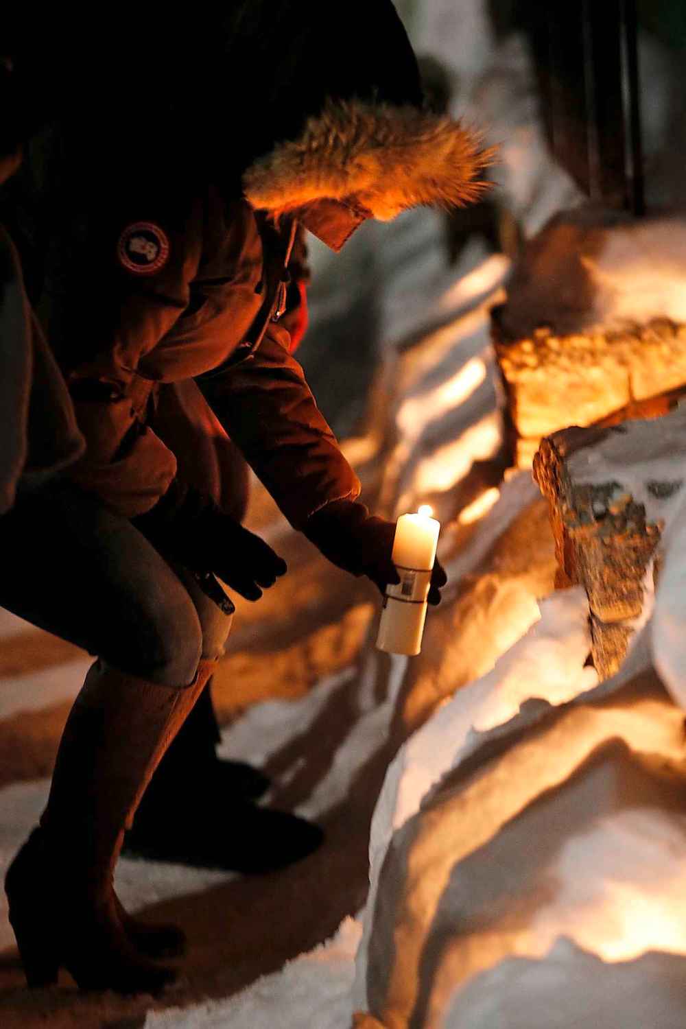 JOHN WOODS / WINNIPEG FREE PRESS
A lit candle is placed at a vigil for Adao Monday outside his family home.