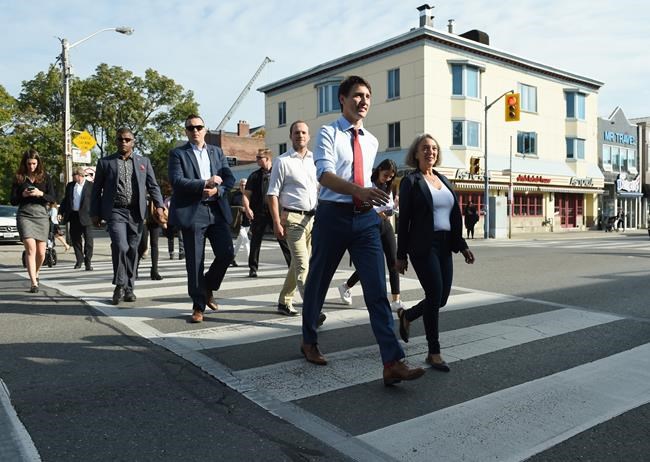 Liberal Leader Justin Trudeau crosses a street as he makes his way to make a policy announcement in Toronto on Friday, Sept. 20, 2019. THE CANADIAN PRESS/Sean Kilpatrick
