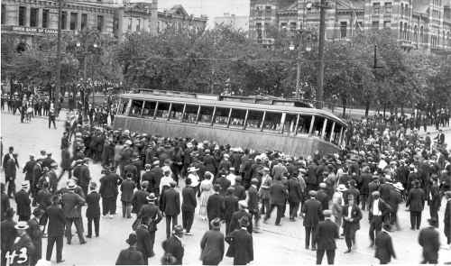 Winnipeg Free Press
1919 Winnipeg general strike street car streetcar overturned on Main Street in front of the old City Hall building (R)