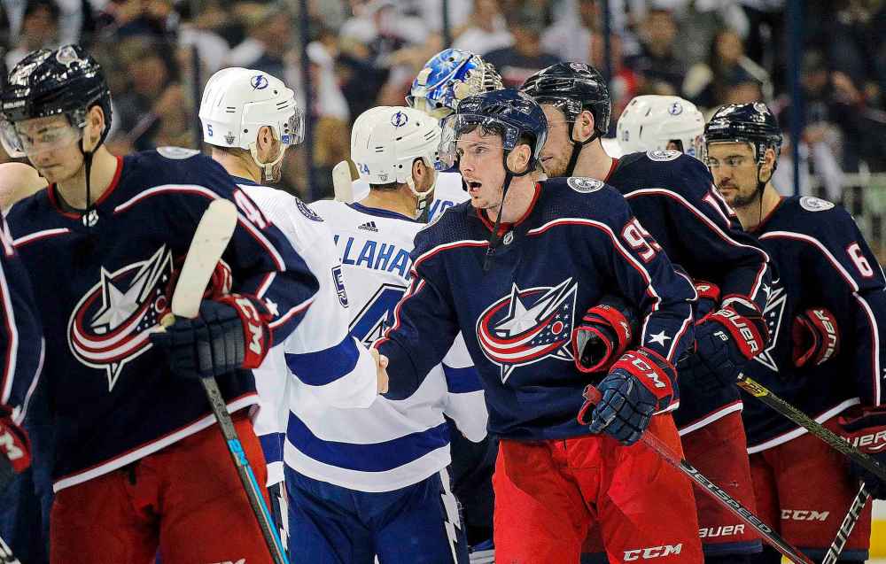 Adam Cairns/Columbus Dispatch/TNS
The Columbus Blue Jackets' Matt Duchene shakes hands with the Tampa Bay Lightning players following Game 4 in the first round of the Stanley Cup Playoffs at Nationwide Arena in Columbus, Ohio, on Tuesday. The Blue Jackets won, 7-3, to sweep the series.