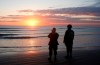 World War II reenactors stand looking out to sea on Omaha Beach, in Normandy, France, at dawn on Thursday, June 6, 2019 during commemorations of the 75th anniversary of D-Day. (AP Photo/Thibault Camus)