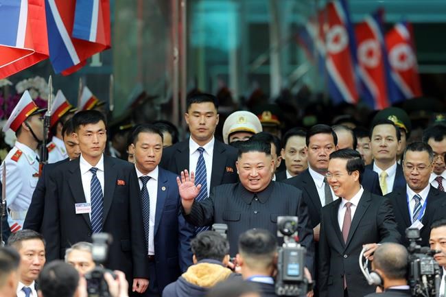 North Korean leader Kim Jong Un waves upon arrival by train in Dong Dang in Vietnamese border town Tuesday, Feb. 26, 2019, ahead of his second summit with U.S. President Donald Trump. (AP Photo/Minh Hoang)
