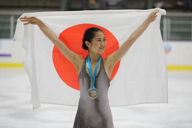 First-place finisher Satoko Miyahara, of Japan, celebrates following the women's free skate at the U.S. International Figure Skating Classic on Saturday, Sept. 21, 2019, in Salt Lake City. (AP Photo/Rick Bowmer)