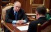 Russian President Vladimir Putin, left, listens to Russian Prime Minister Dmitry Medvedev, back to a camera, during their meeting in the Kremlin in Moscow, Russia, Wednesday, Oct. 9, 2019. (Alexei Druzhinin, Sputnik, Kremlin Pool Photo via AP)