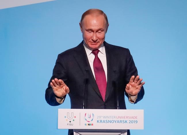 Russian President Vladimir Putin gestures while speaking during the opening ceremony for the 29th Winter Universiade games at the Platinum Arena in Krasnoyarsk, Russia, Saturday, March 2, 2019. (Maxim Shemetov/Pool Photo via AP)