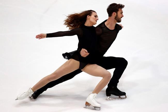 Gabriella Papadakis and Guillaume Cizeron of France compete in the Ice Dance Free Dance during the ISU figure skating France's Trophy, in Grenoble, French Alps, France, Saturday, Nov. 2, 2019. (AP Photo/Francois Mori)