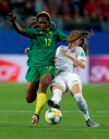 Cameroon's Claudine Meffometou, left, and Canada's Janine Beckie battle for the ball during the Women's World Cup Group E soccer match between Canada and Cameroon in Montpellier, France, Monday, June 10, 2019. (AP Photo/Claude Paris)