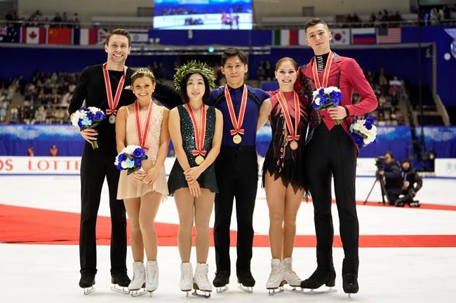 CORRECTS NAMES OF RUSSIAN PAIR - Silver medalists Kirsten Moore-Towers and Michael Marinaro of Canada, left, gold medalists Sui Wenjing and Han Cong of China, center, and bronze medalists Anastasia Mishina and Aleksandr Galliamov of Russia pose with their medals at a victory ceremony after the pairs free skating program during the ISU Grand Prix of Figure Skating in Sapporo, northern Japan, Saturday, Nov. 23, 2019. (AP Photo/Toru Hanai)