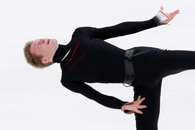 Russia's Alexander Samarin performs during the men's free skating at the ISU Grand Prix of Figure Skating- Rostelecom Cup in Moscow, Russia, Saturday, Nov. 16, 2019. (AP Photo/Alexander Zemlianichenko)