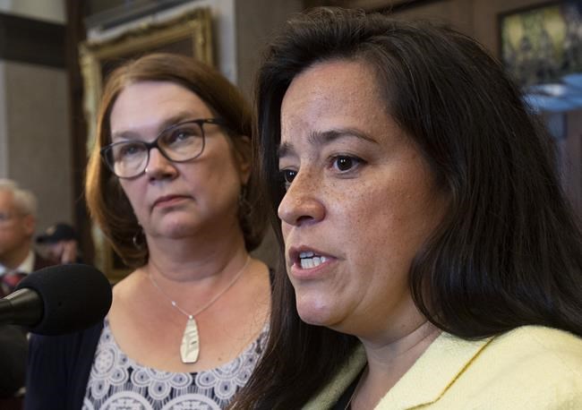 Independent MPs Jane Philpott and Jody Wilson-Raybould speak with the media before Question Period in the Foyer of the House of Commons in Ottawa, Wednesday April 3, 2019. Former cabinet minister Philpott says Prime Minister Justin Trudeau violated the law when he expelled her and Wilson-Raybould from the Liberal caucus.THE CANADIAN PRESS/Adrian Wyld
