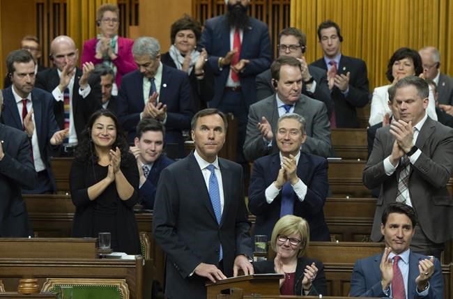 Finance Minister Bill Morneau receives a standing ovation from members as he delivers the federal budget in the House of Commons in Ottawa, Tuesday March 19, 2019. THE CANADIAN PRESS/Sean Kilpatrick