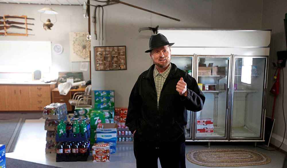 Edward Hofer talks to Bill Redekop at the James Valley Colony, west of Winnipeg.