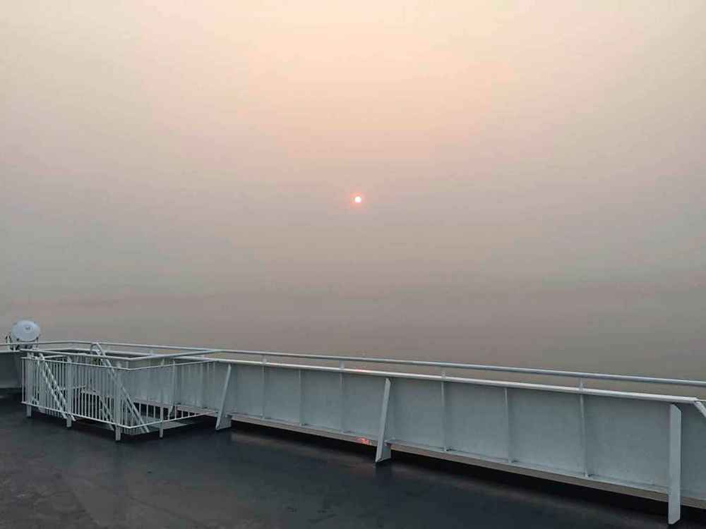 The smoke from nearly 600 wildfires made it appear like a partial eclipse of the sun was occurring. (Dan Lett / Winnipeg Free Press)