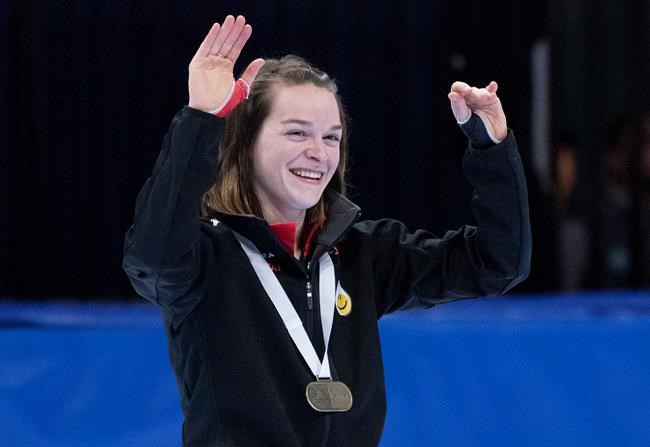 Canada's Kim Boutin waves to the crowd after winning the gold medal in the women 500 metre final at the ISU World Cup Short Track competition in Montreal on Sunday, November 10, 2019. THE CANADIAN PRESS/Paul Chiasson