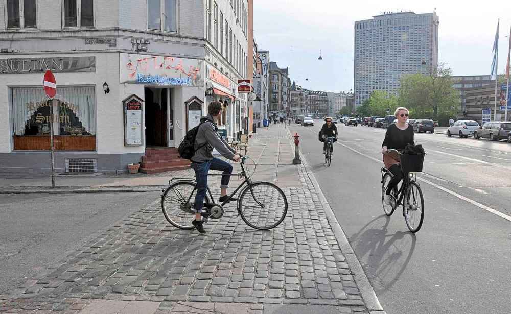 Raised crosswalks in Copenhagen prioritize pedestrians and cyclists as they interact with cars at intersections. (Supplied)