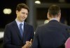 Winnipeg mayor Brian Bowman finishes speaking as Prime Minister Justin Trudeau looks on at a transit funding announcement at the Winnipeg Transit bus barn, Tuesday, February 12, 2019. THE CANADIAN PRESS/Trevor Hagan